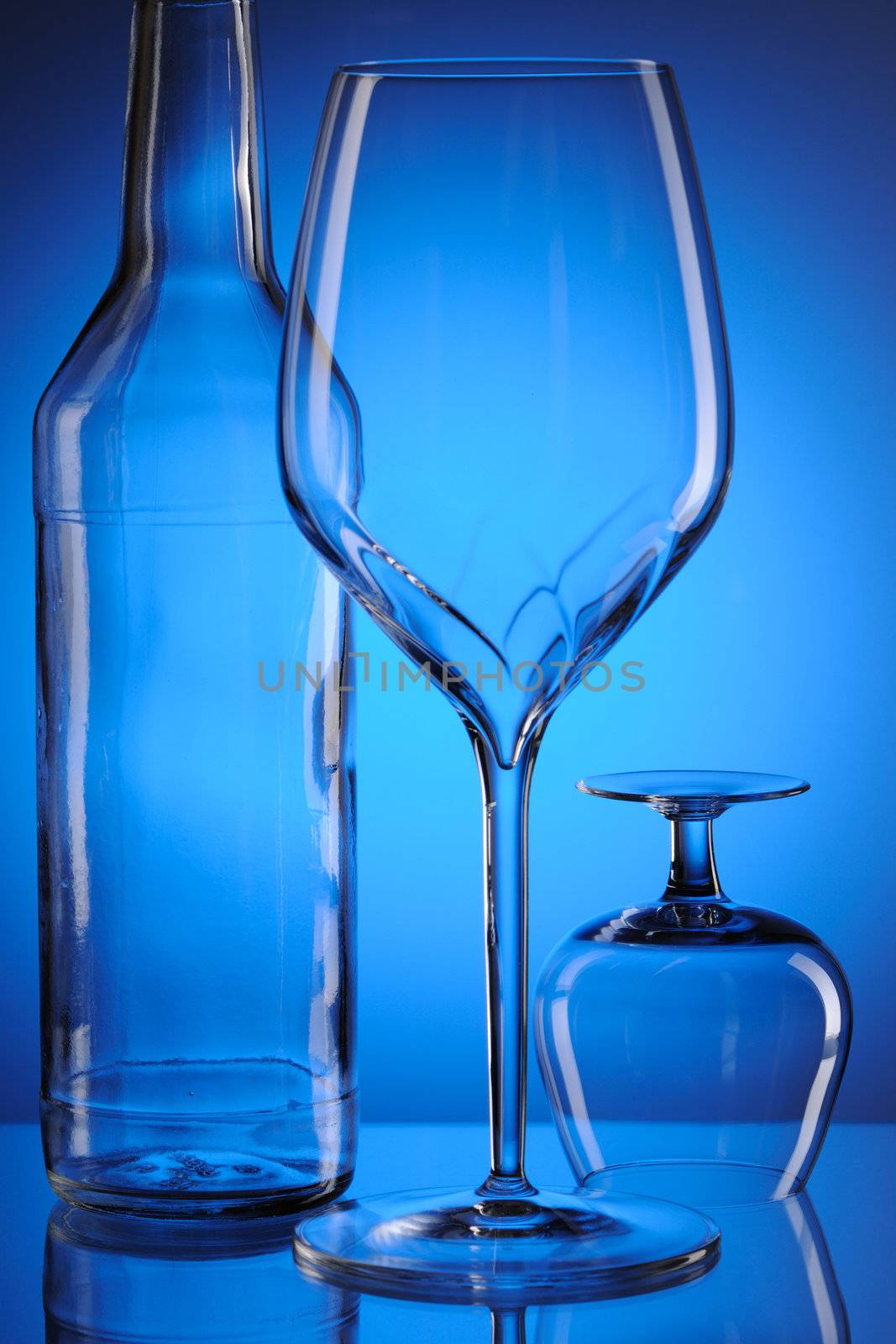 Glass still life over blue background