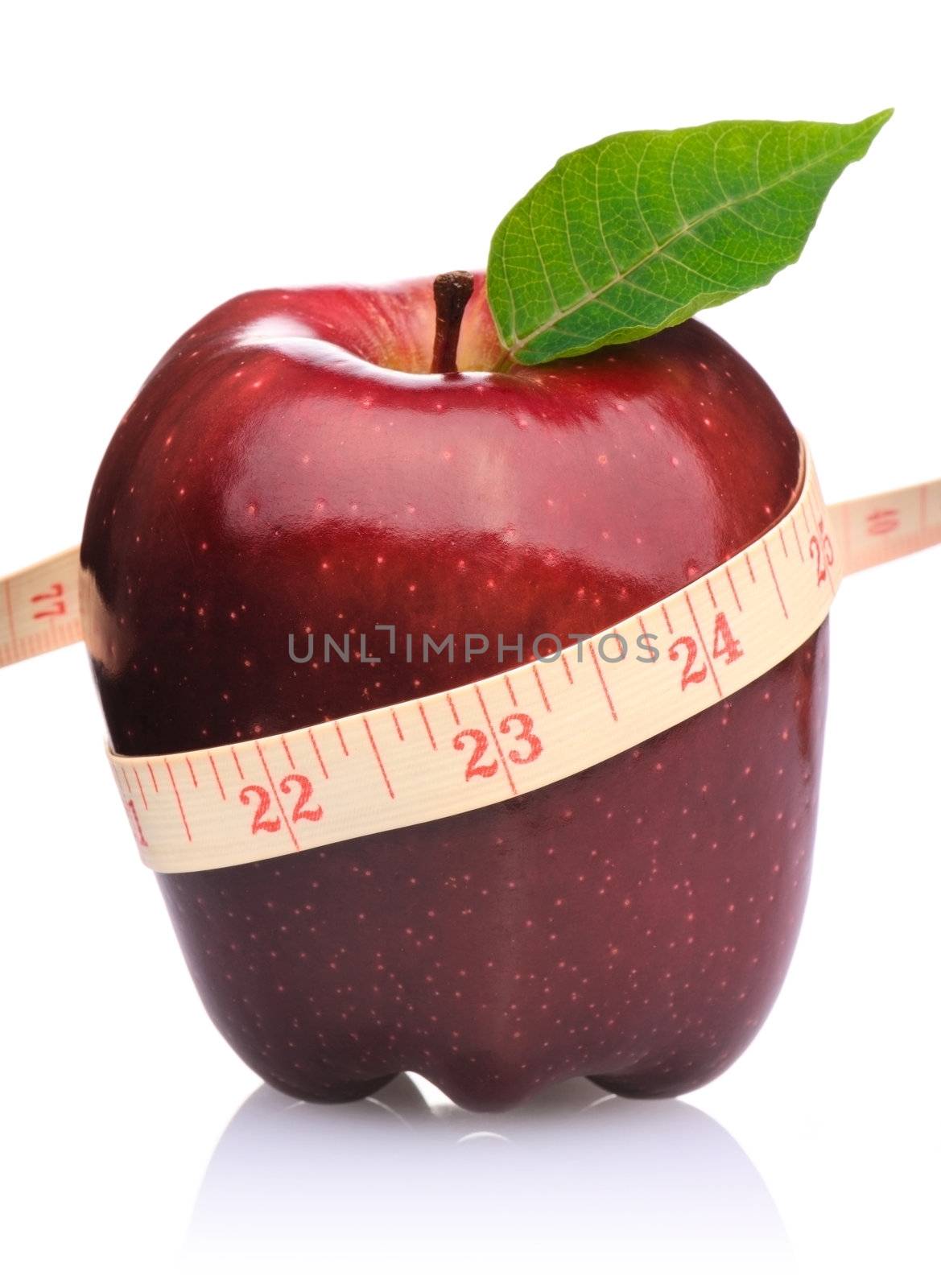 Measurement tape wrapped around red apple