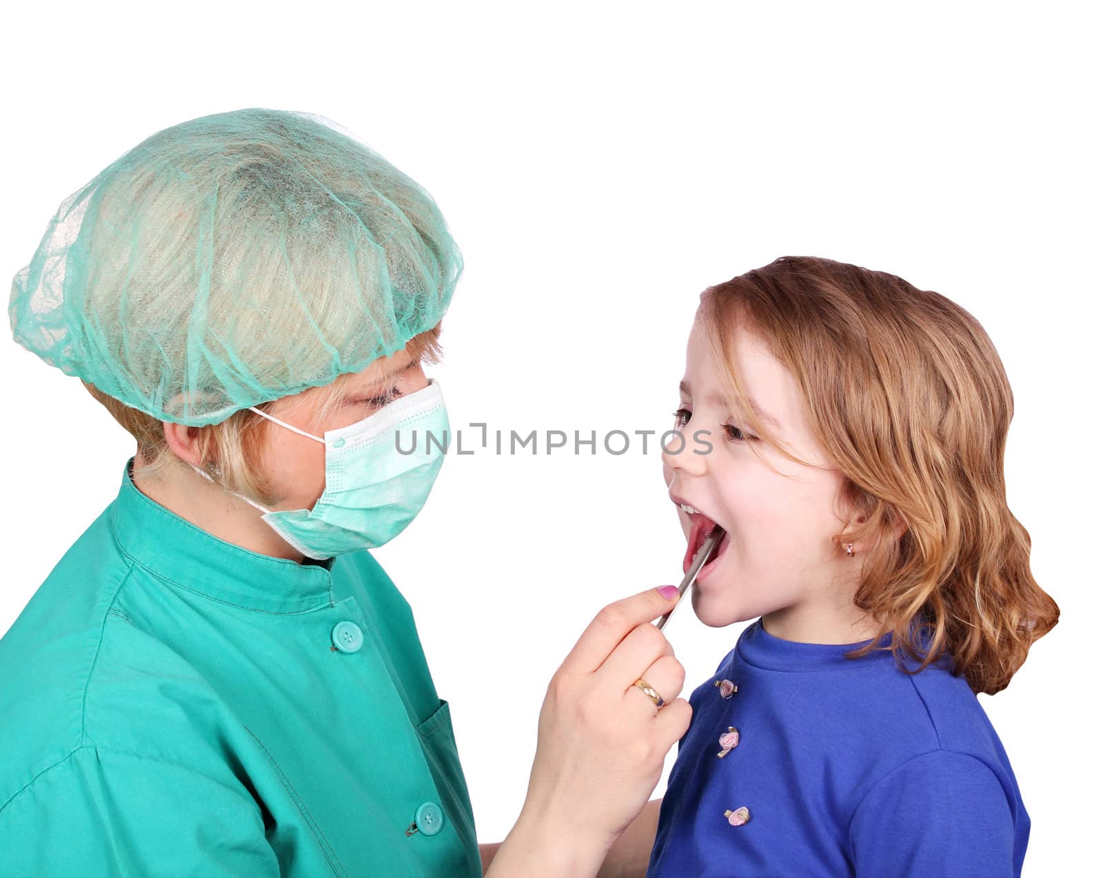 female doctor examines the throat of little girl