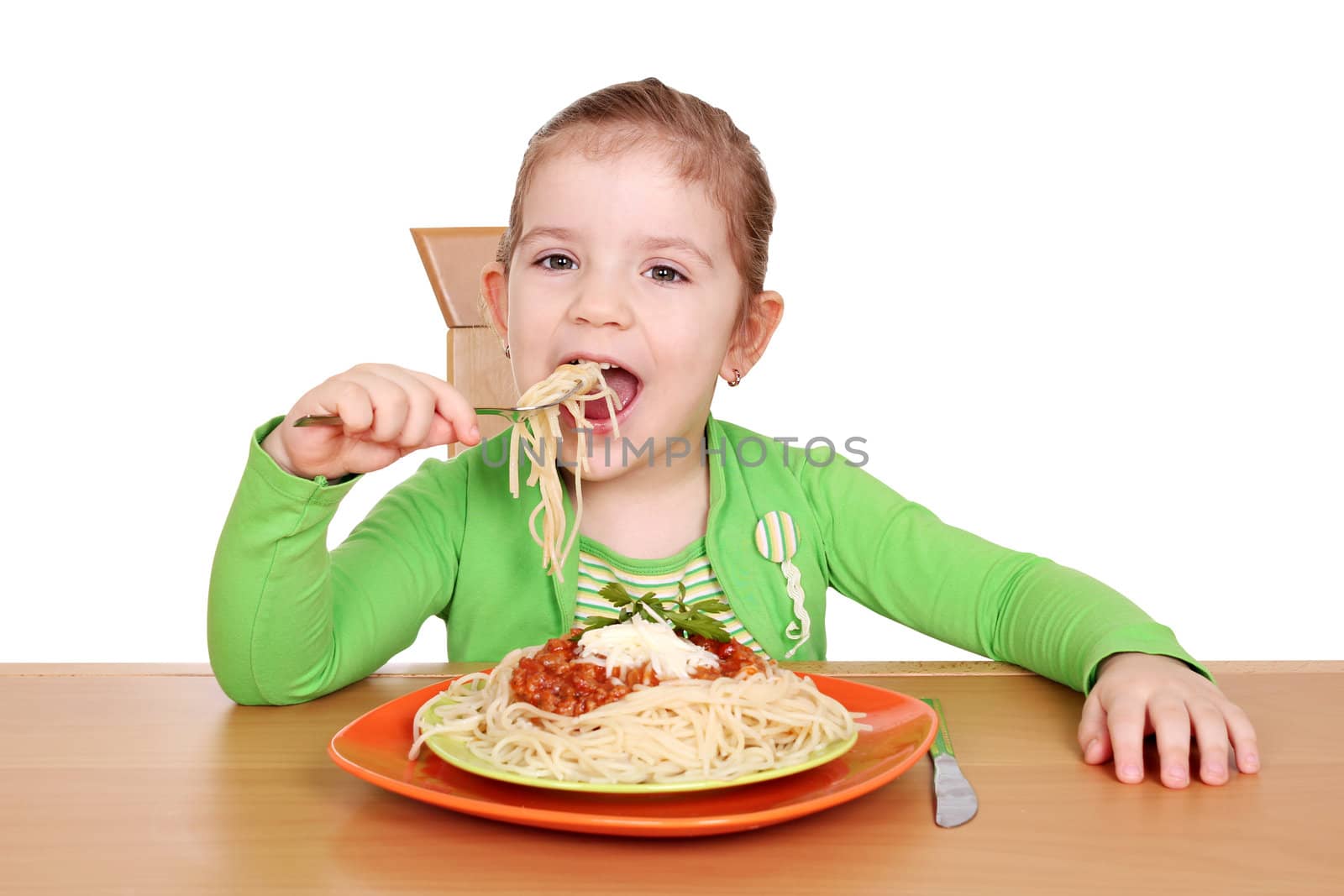 hungry little girl eating spaghetti