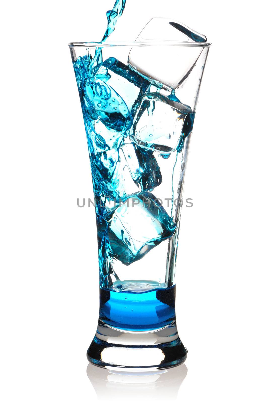 Pouring Blue Curacao cocktail in glass