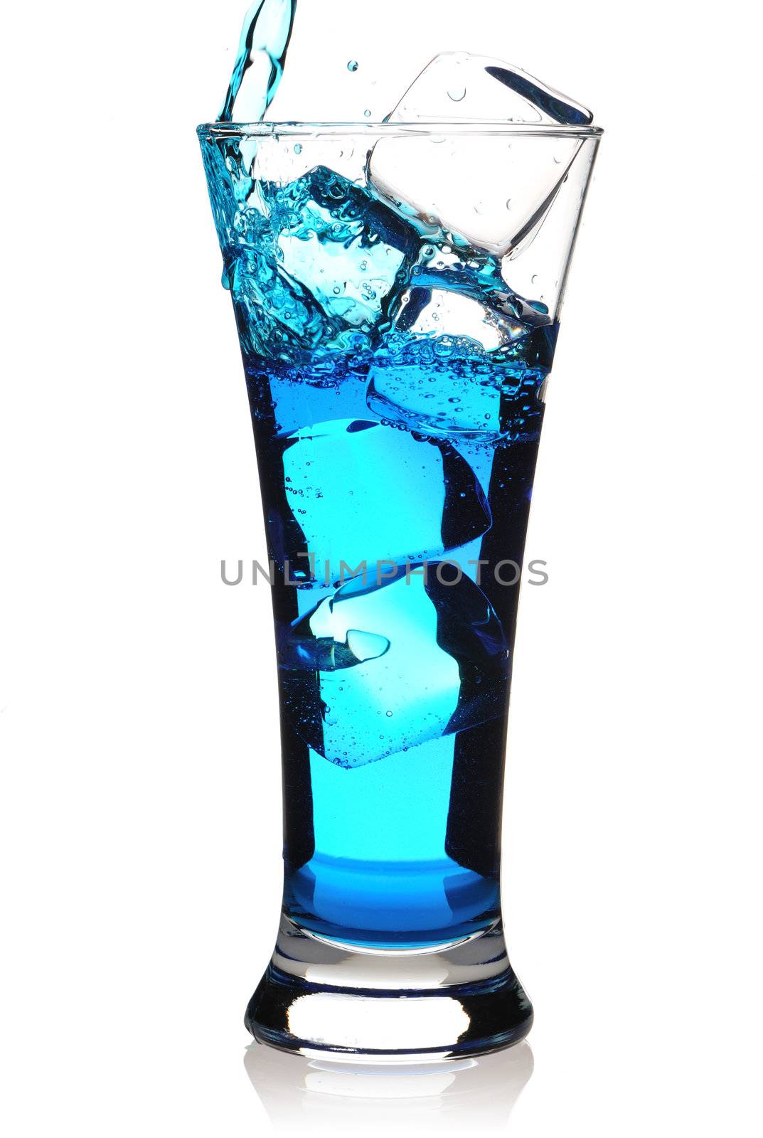 Pouring Blue Curacao cocktail in glass