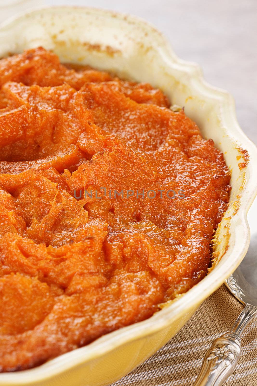 Sweet potato casserole. Extreme shallow depth of field with selective focus on center on potatoes. 