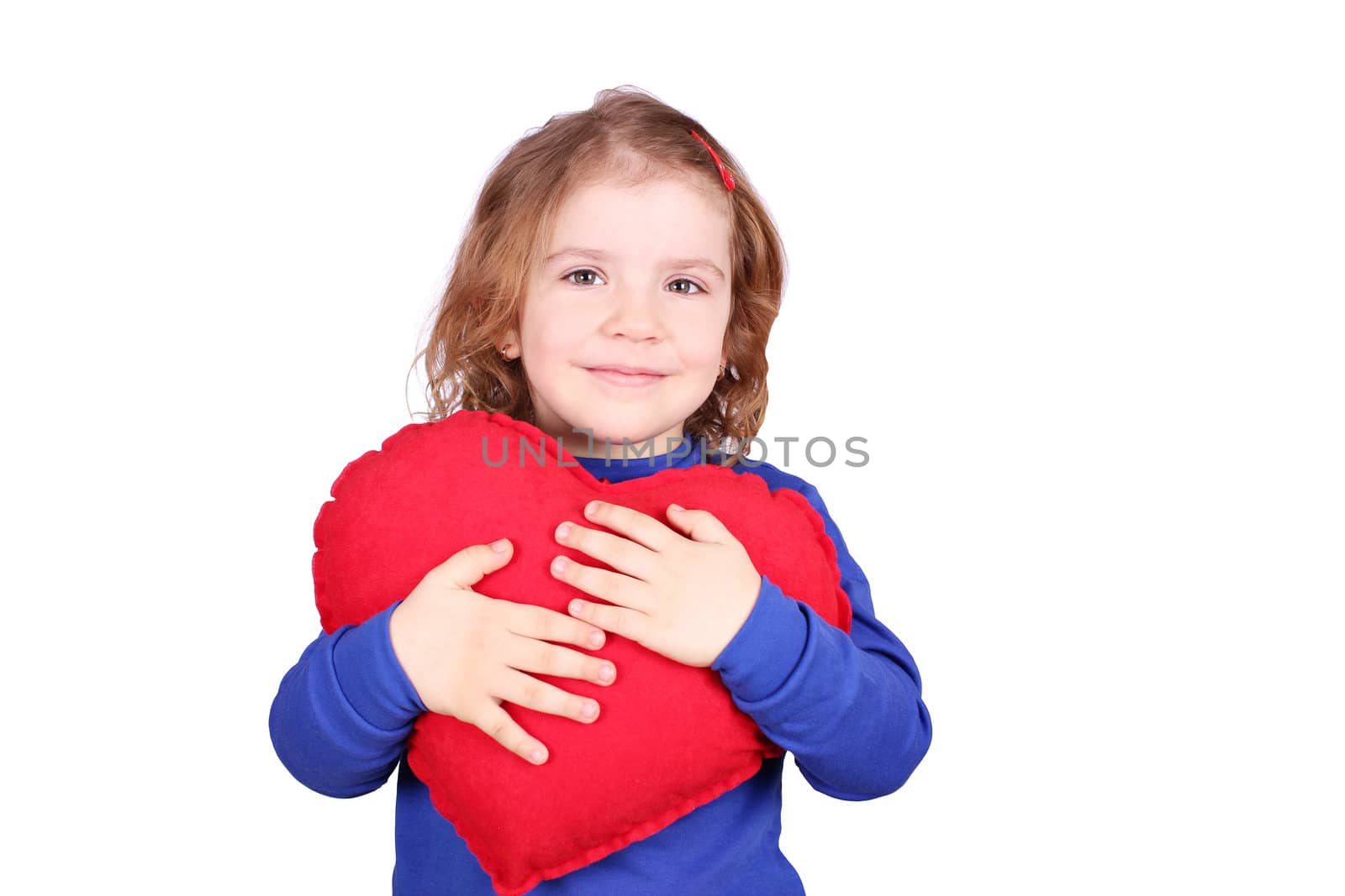 happy little girl holding red heart