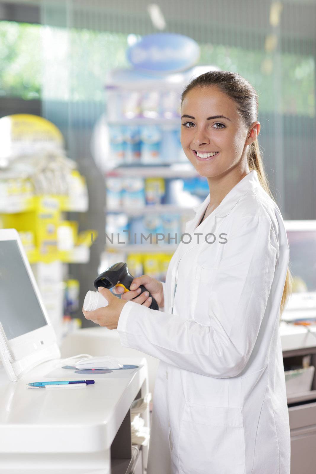 Portrait of a smiling female pharmacist at pharmacy