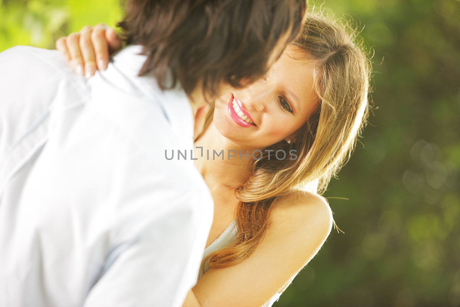 a young couple in love having fun in the park