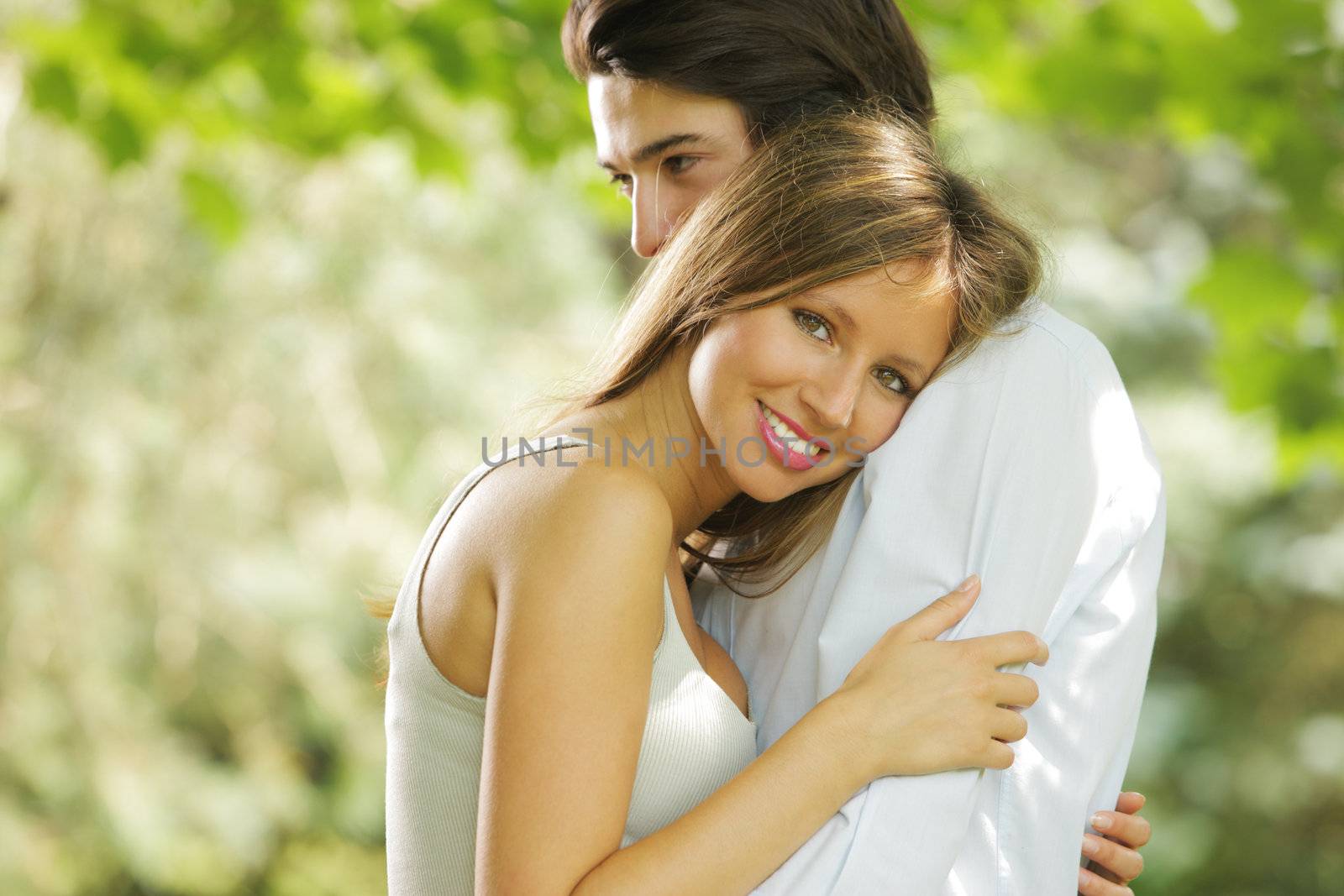 the romantic embrace of a young couple in love