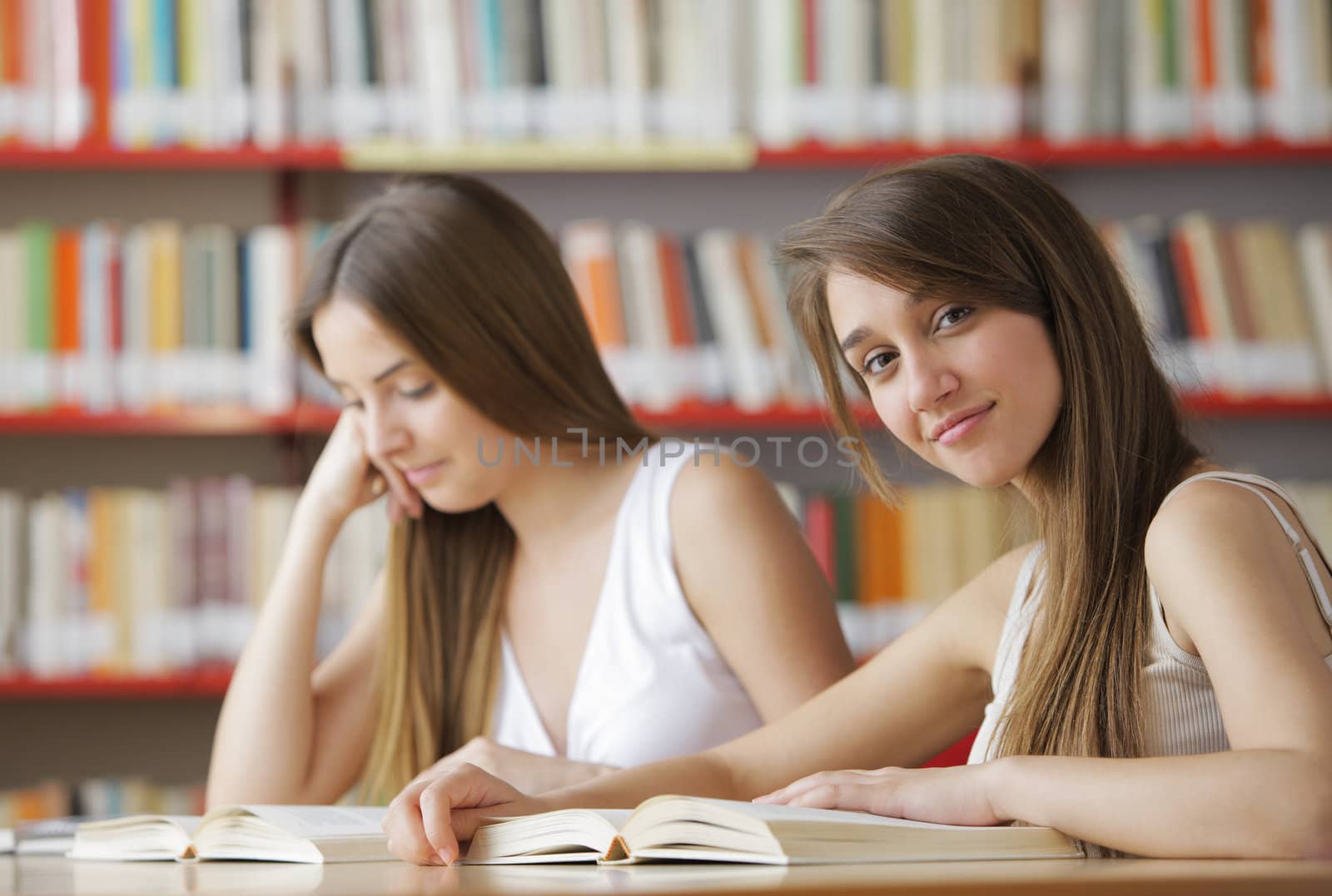 Female College Students in a Library