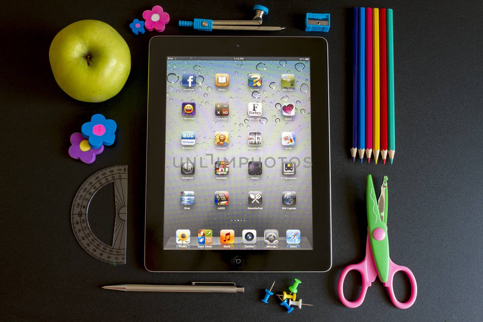 Ipad 3 with school accesories on white background