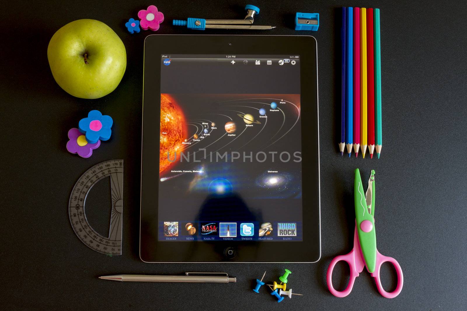 Ipad 3 with school accesories on white background