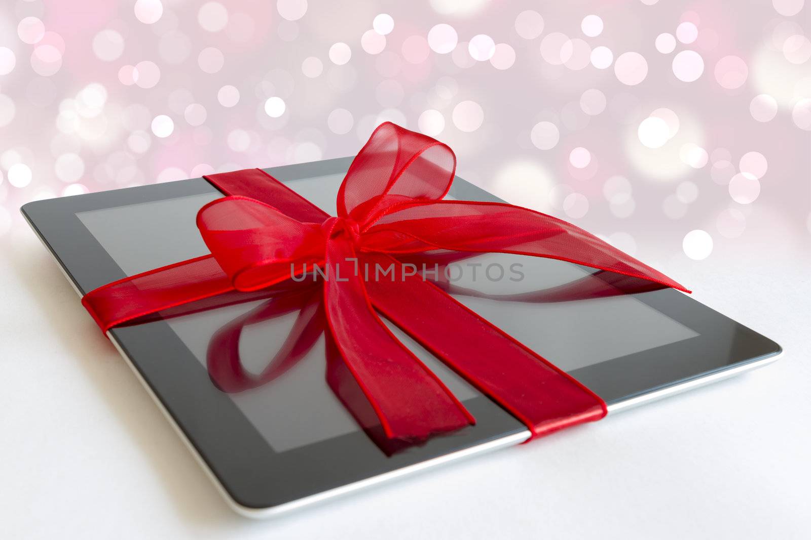 Digital tablet with christmas present by manaemedia