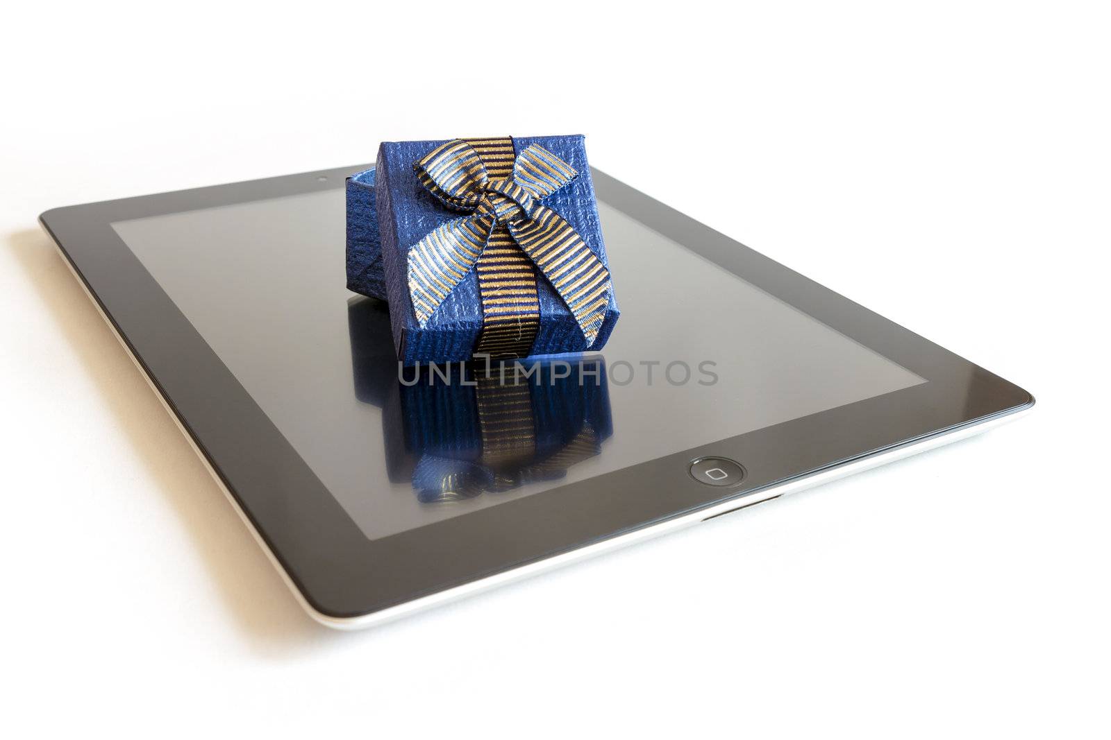 Digital tablet with christmas present by manaemedia