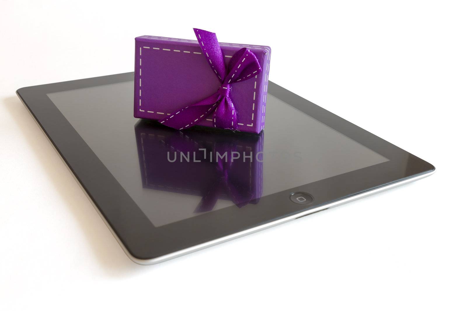 Digital tablet with christmas present by manaemedia