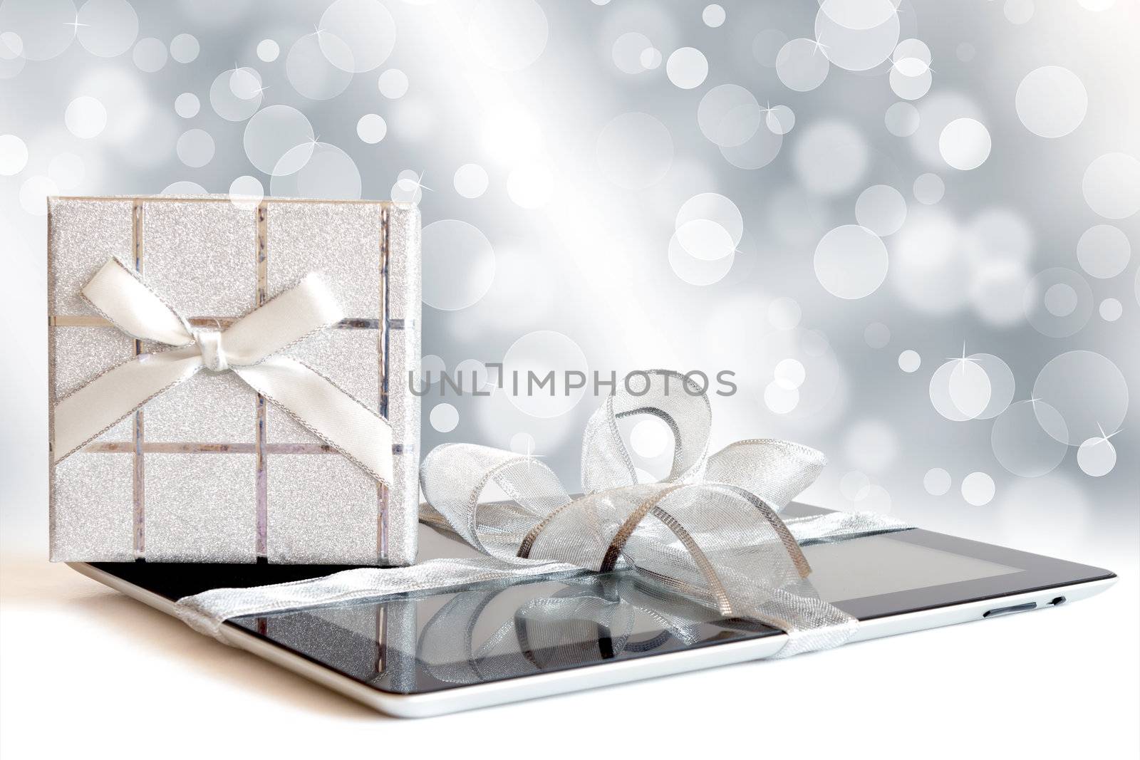 Digital tablet with christmas present by manaemedia