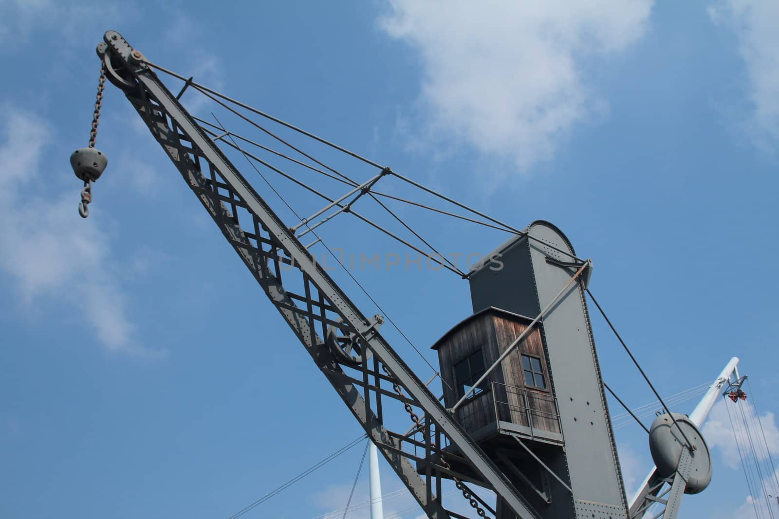 Old crane and Bigo structure at the port of Genoa
