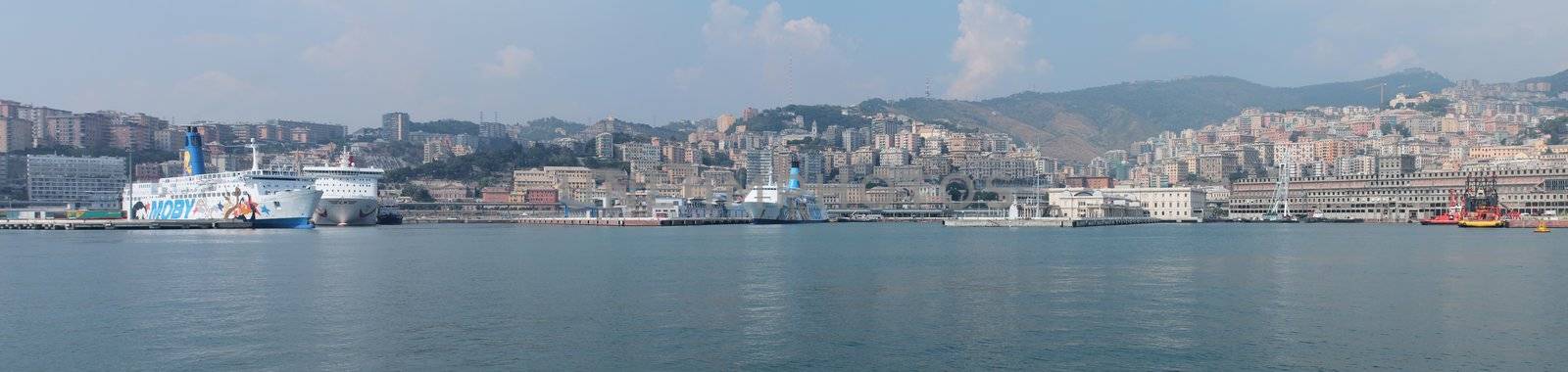 Panorama of ferries docked in the port of Genoa. This photo is made attaching together various photos
