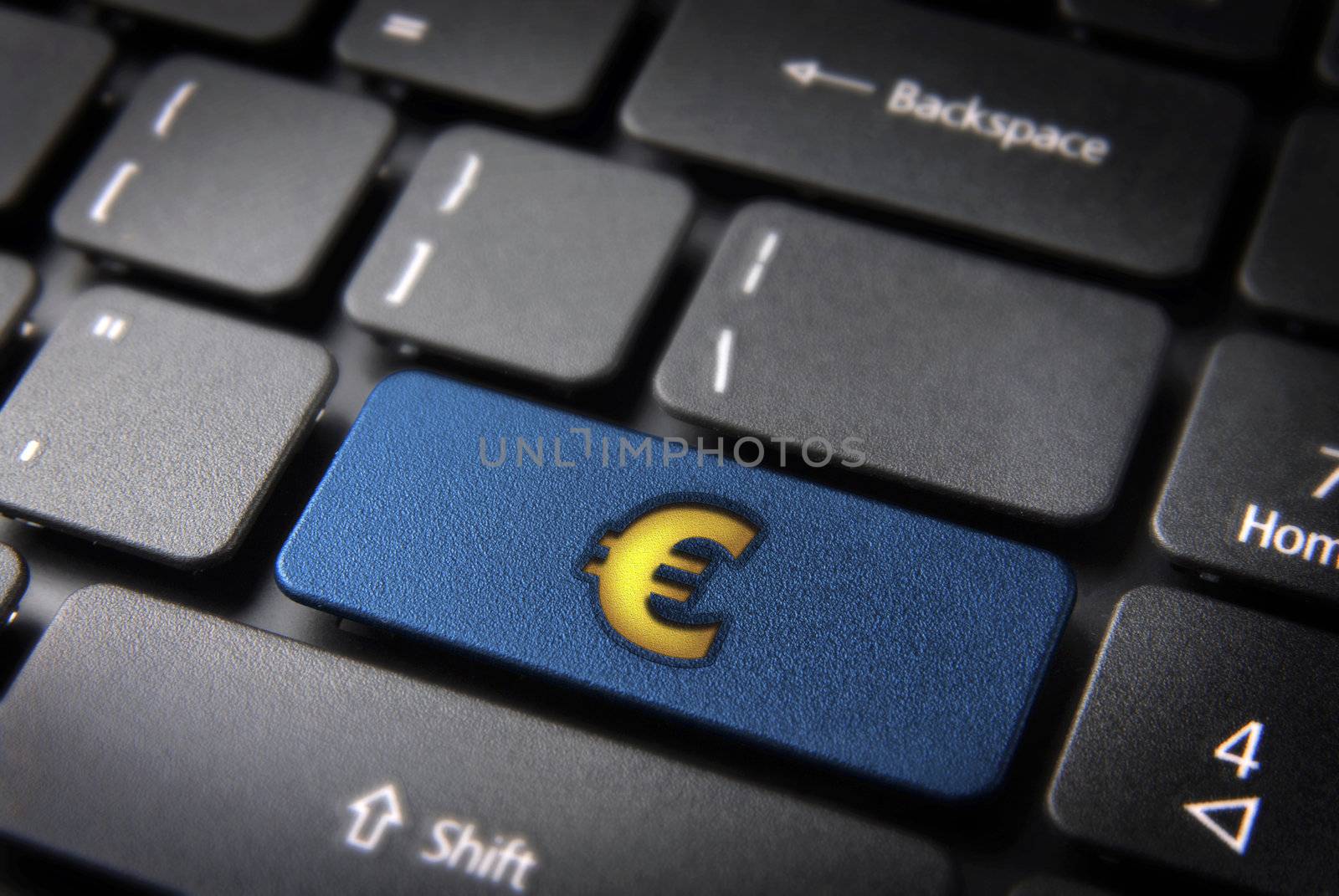 Make money with internet concept: blue key with yellow euro sign on laptop keyboard. Included clipping path, so you can easily edit it.