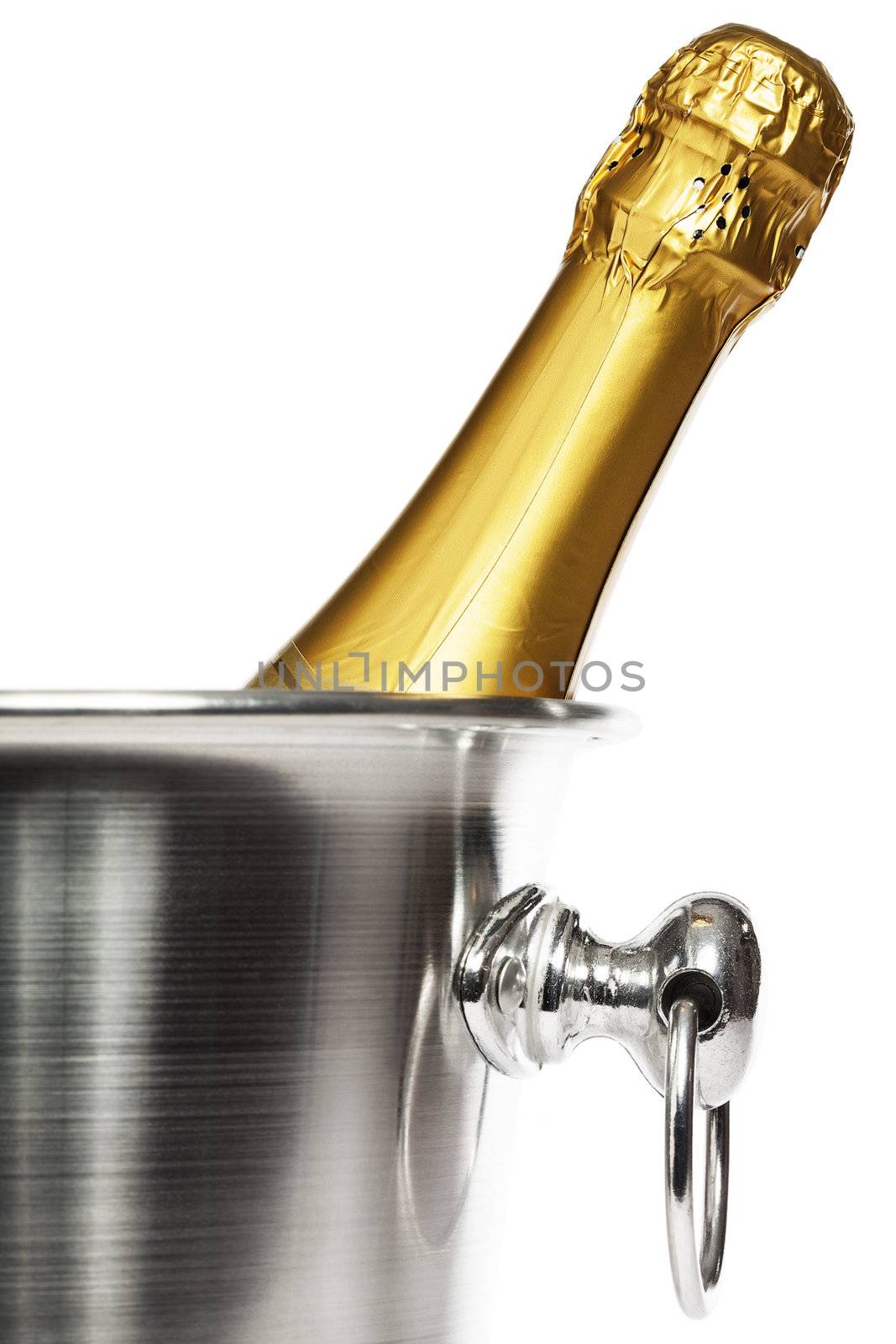 closeup of a bottle of champagne in a champagne bucket on white background