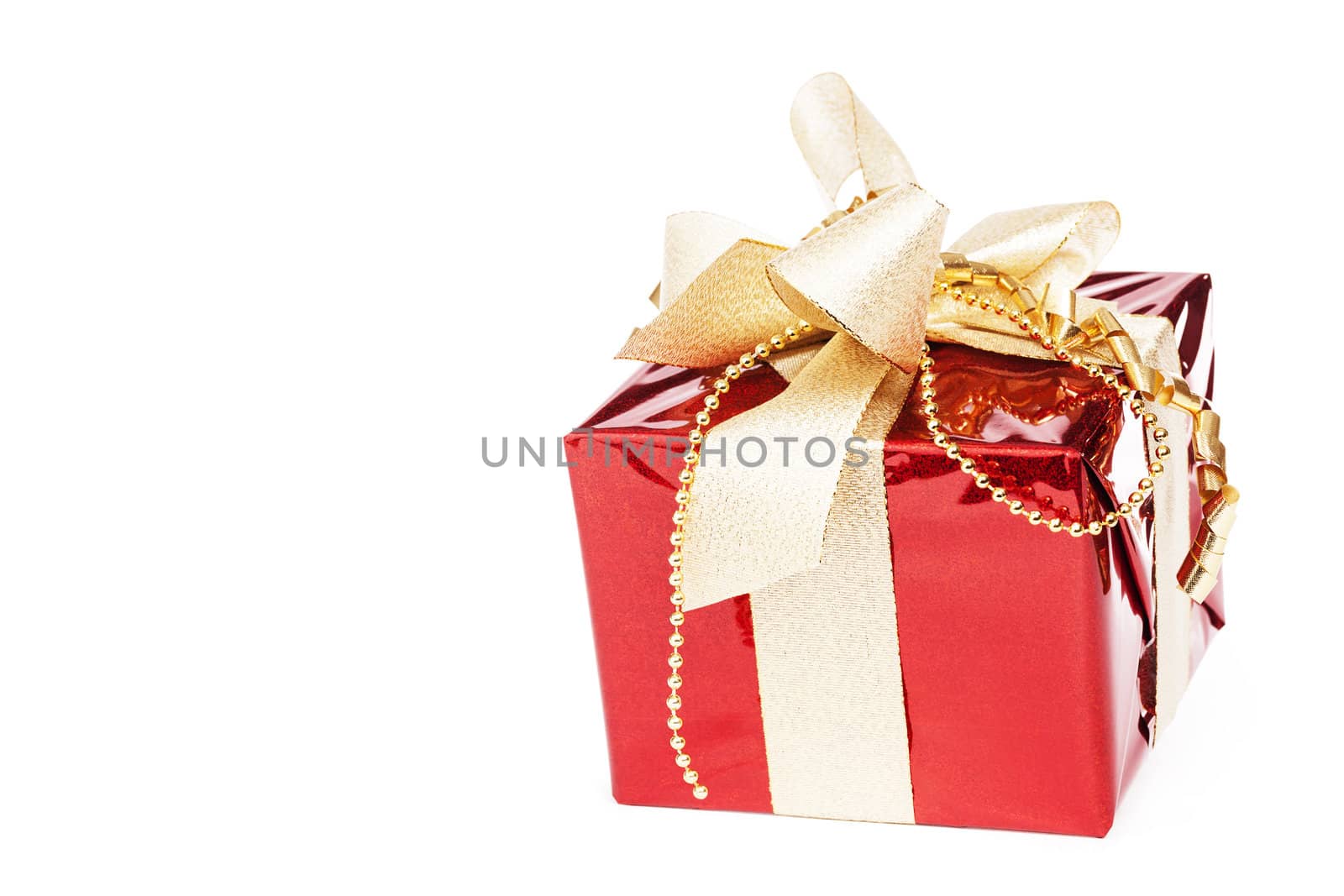 beautiful red christmas present with golden ribbons on white background