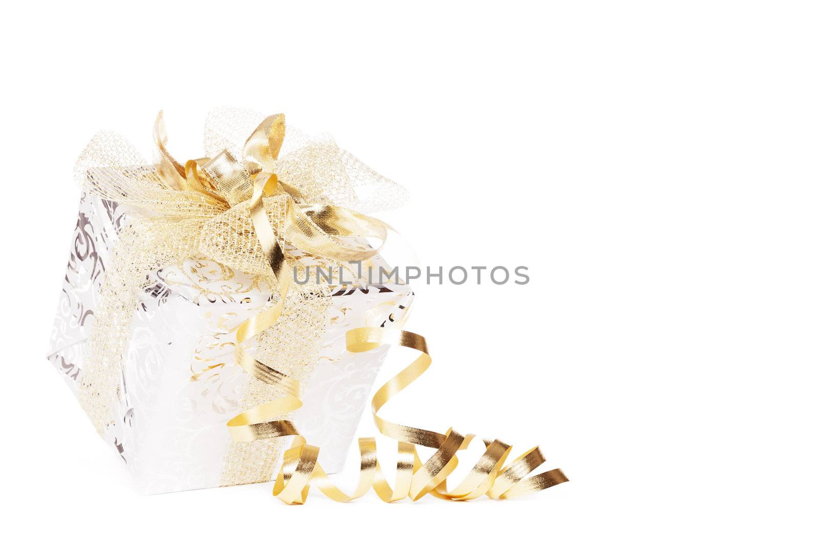 beautiful silver christmas present with golden ribbons and streamer on white background