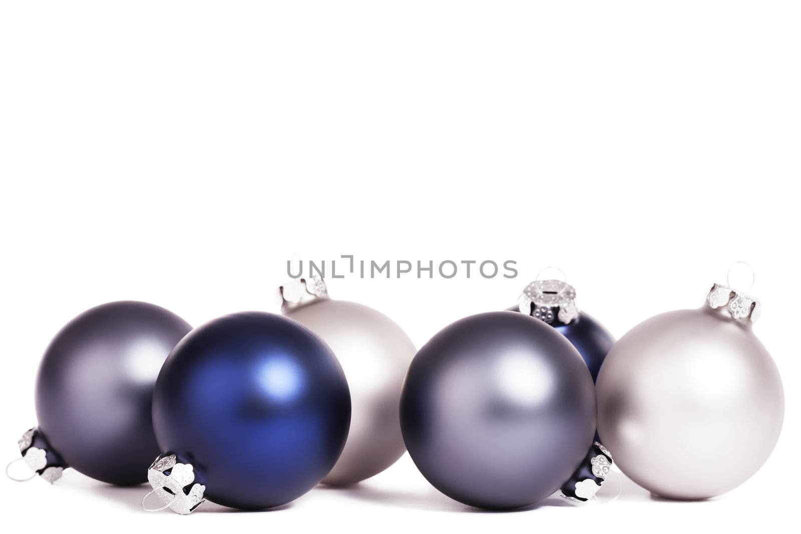 some silver and blue christmas balls on white background