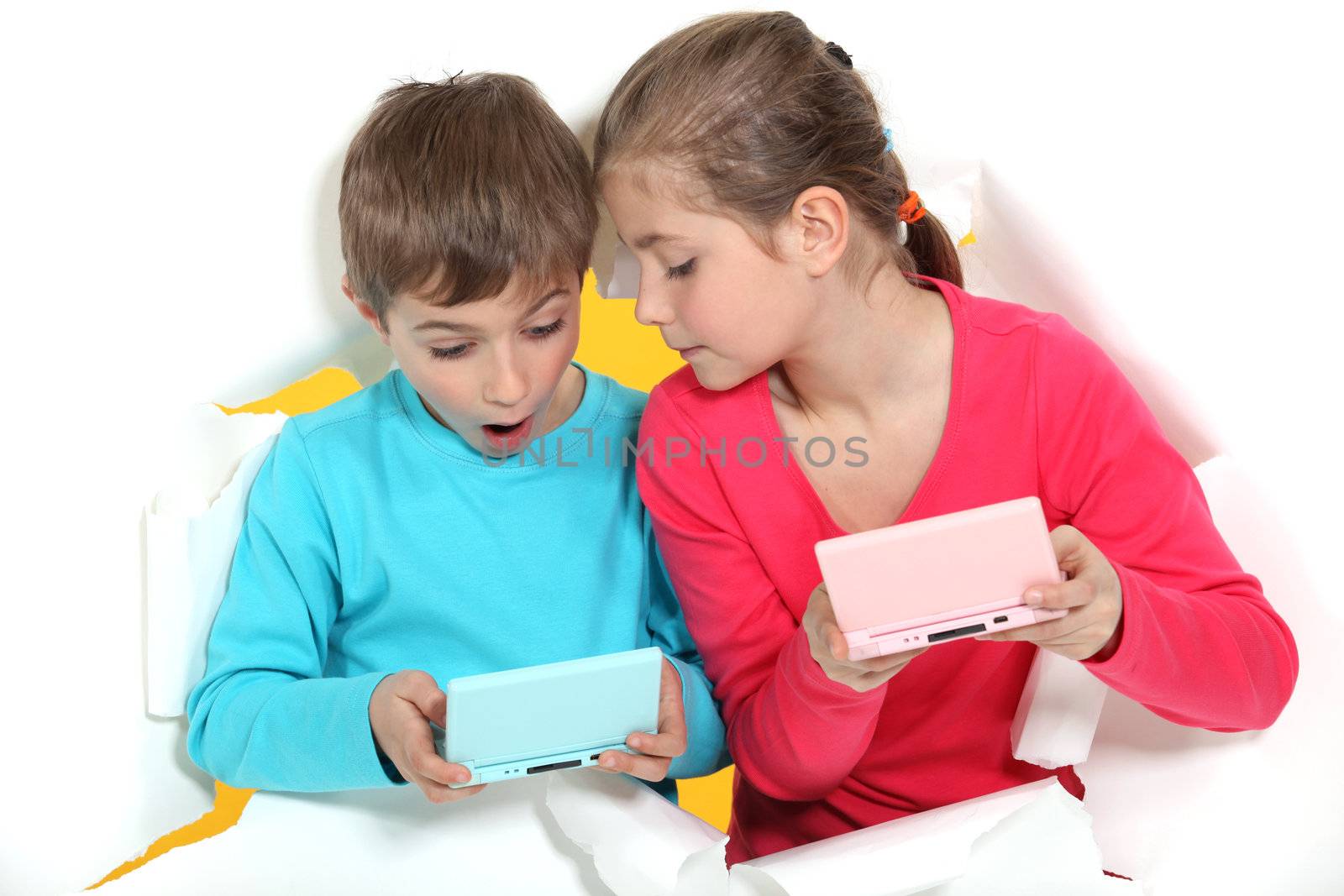 Brother and sister playing video games by phovoir