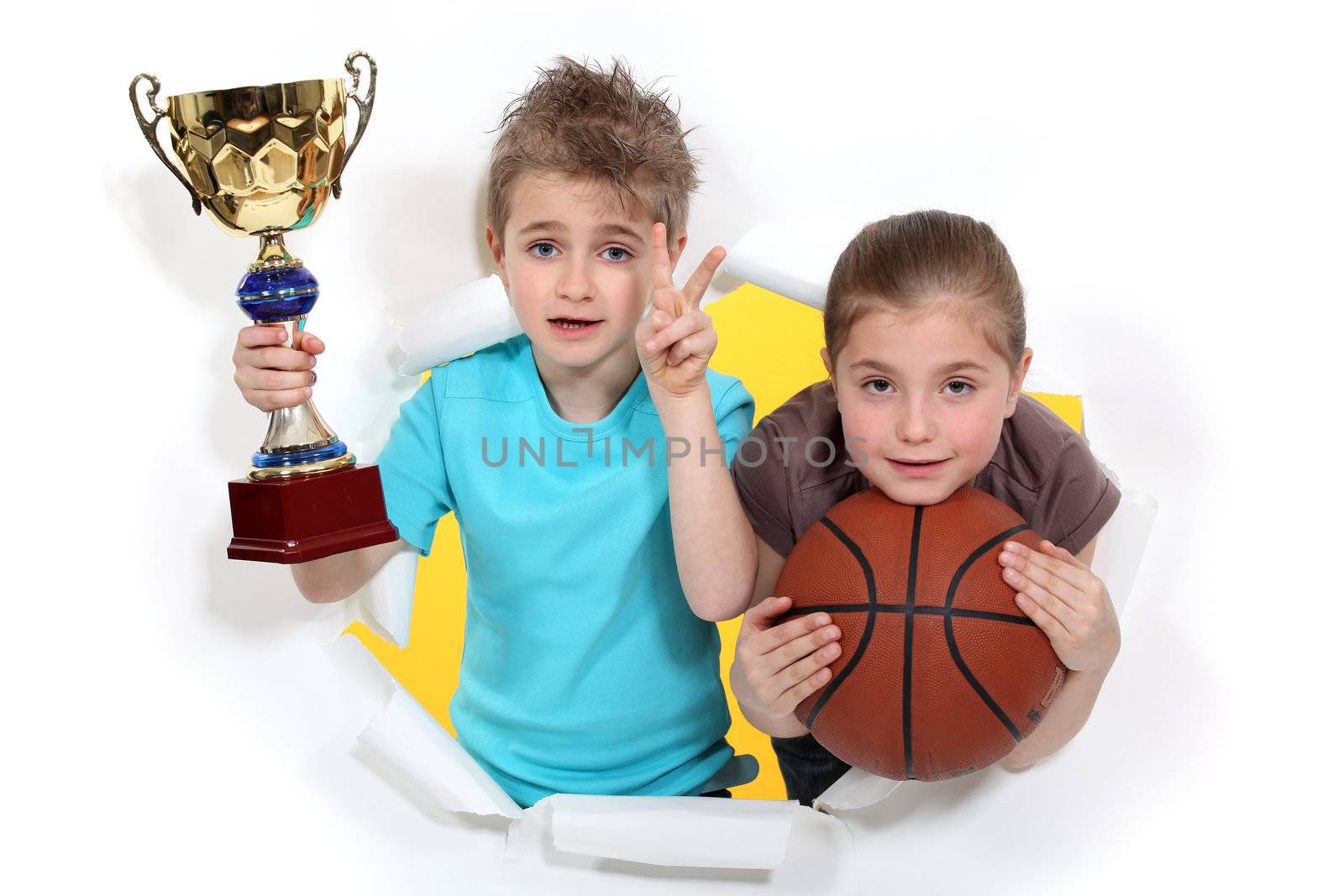 Children with glass and basketball by phovoir