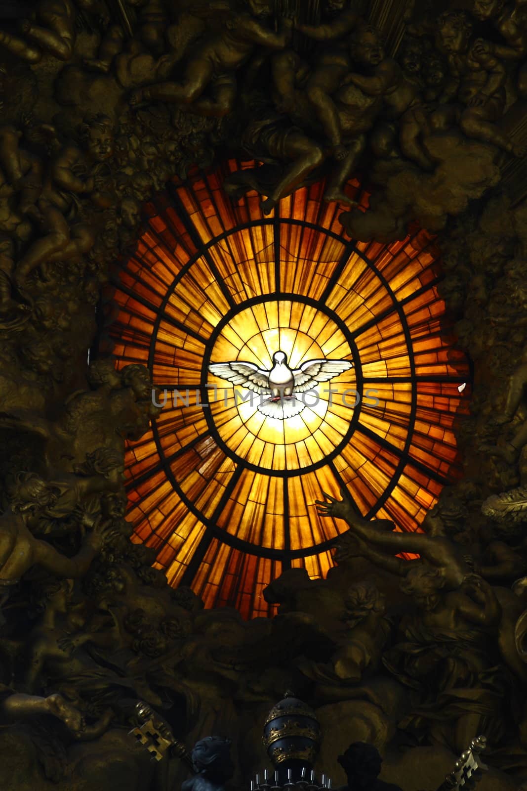 Stain glass behind the altar at St. Peters in the Vatican, Italy