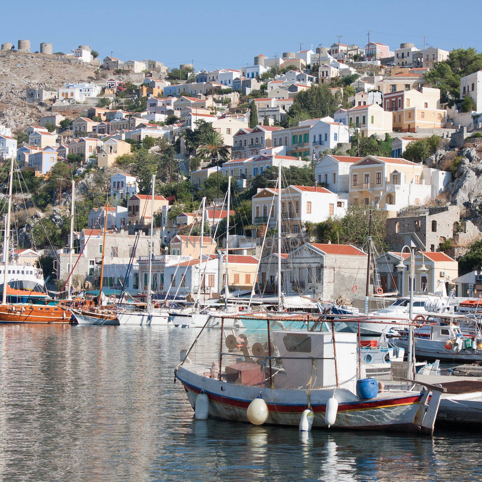 Gialos, the harbour of the island of Symi in the Dodecanese, southeast of Aegean Sea, Greece, with its neoclassical pastel-coloured mansions.