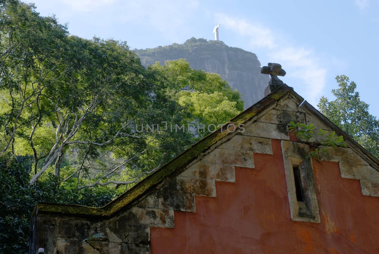 The old red house and the Corcovado Christ Statue view