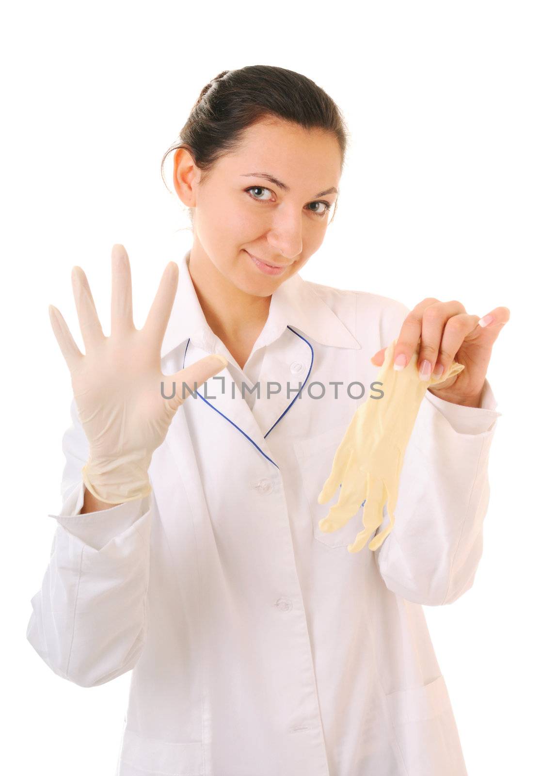 Woman in white coat is demonstrating medical gloves. Isolated on white background.