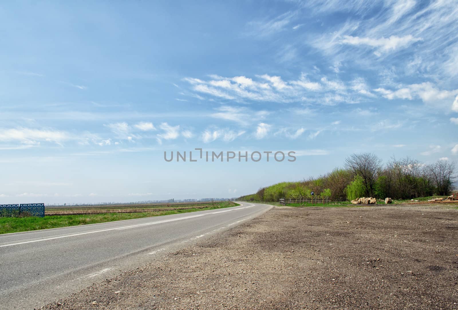 Country road with blue sky in the summer