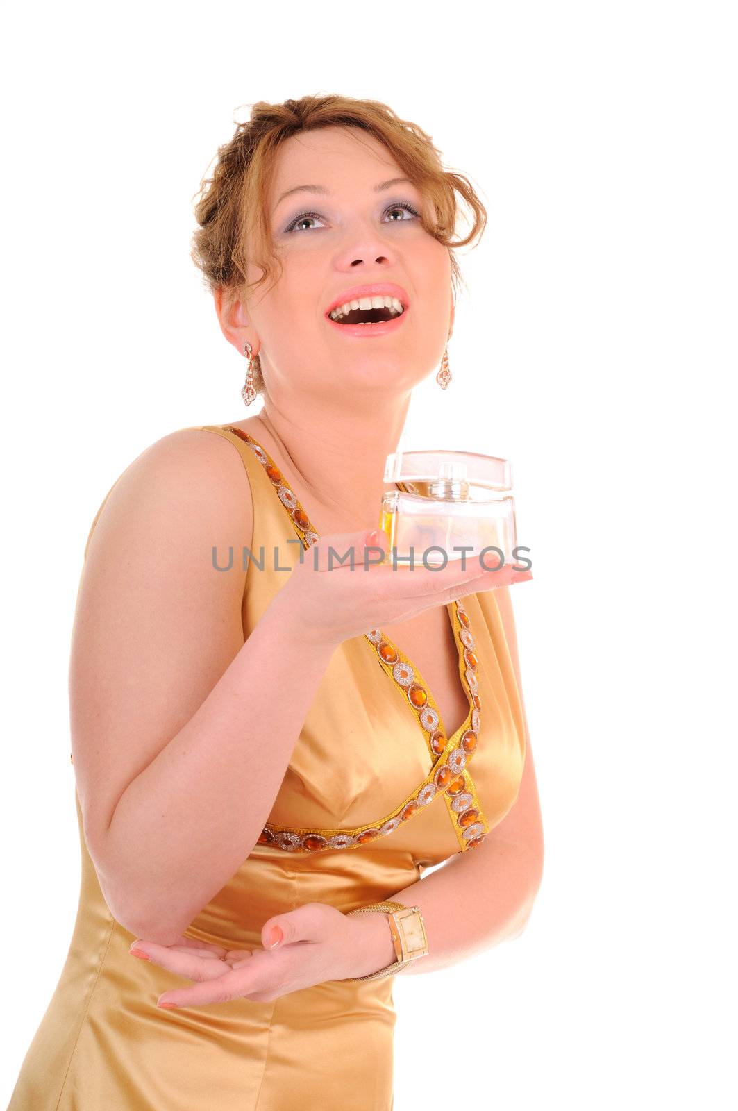 Happy laughing woman in gold dress with perfum bottle isolated on white background