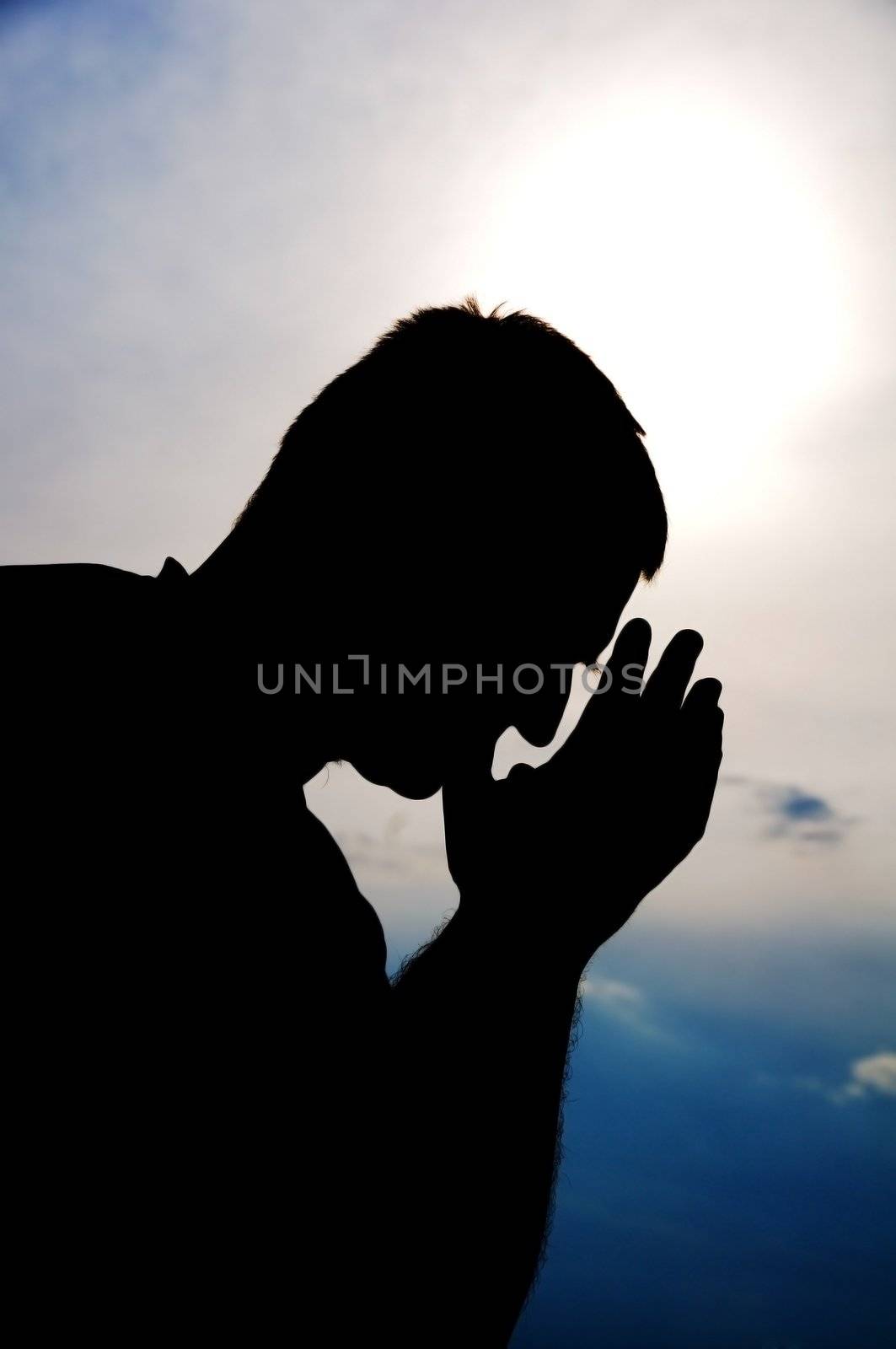 Praying man. Silhouette.