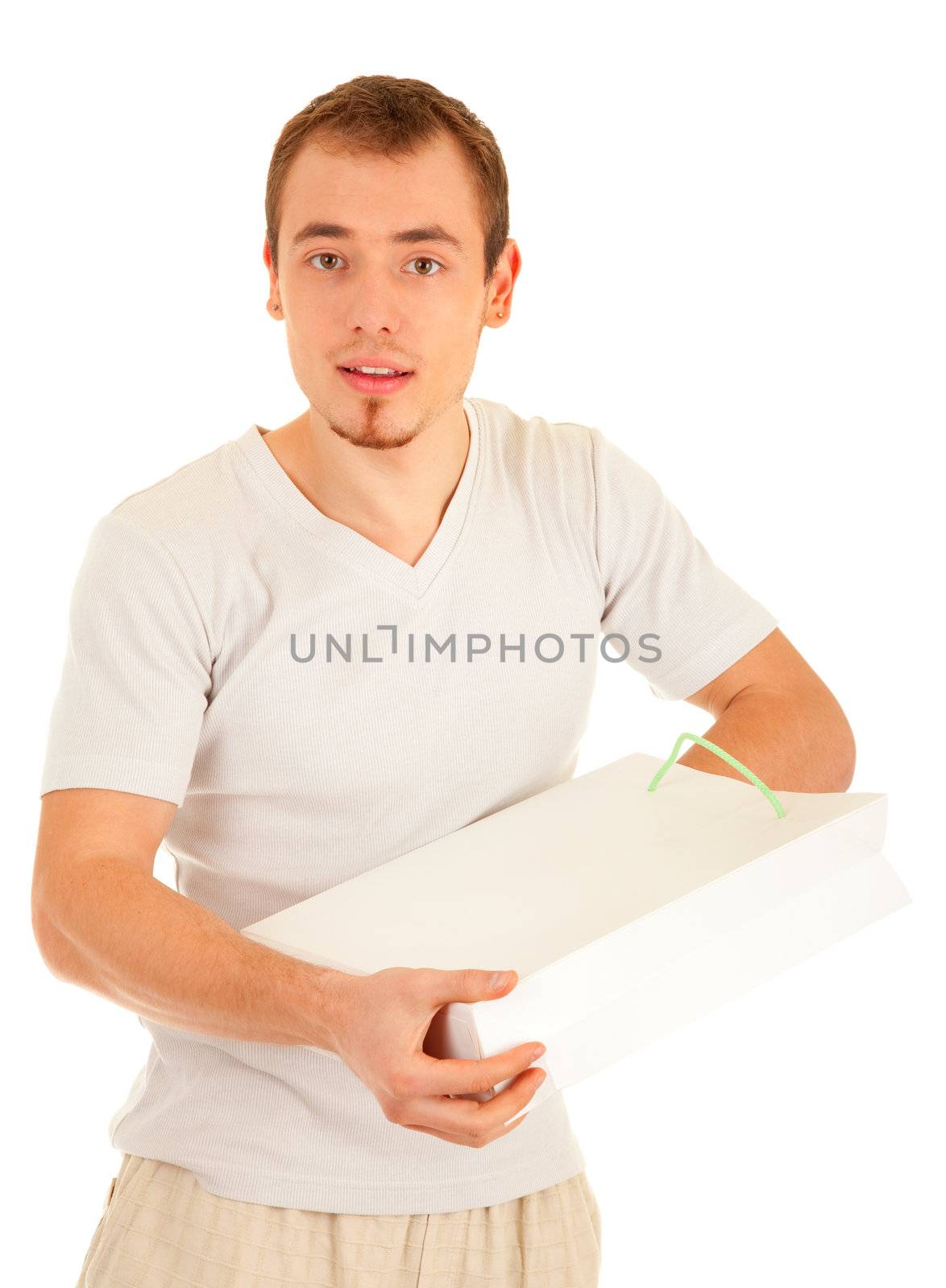 Interested handsome man is checking inside white gift paper bag. Isolated on white background.