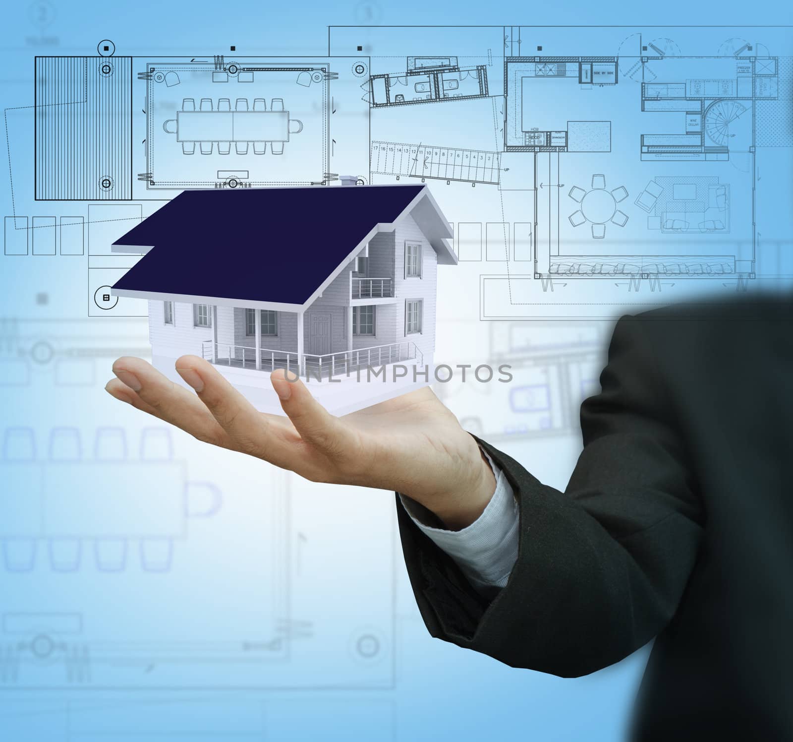 Businessman present house model and plan on touch screen by buchachon