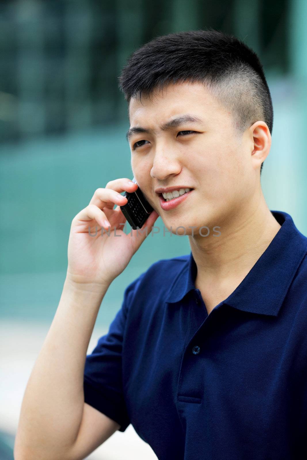 asian man with cell phone