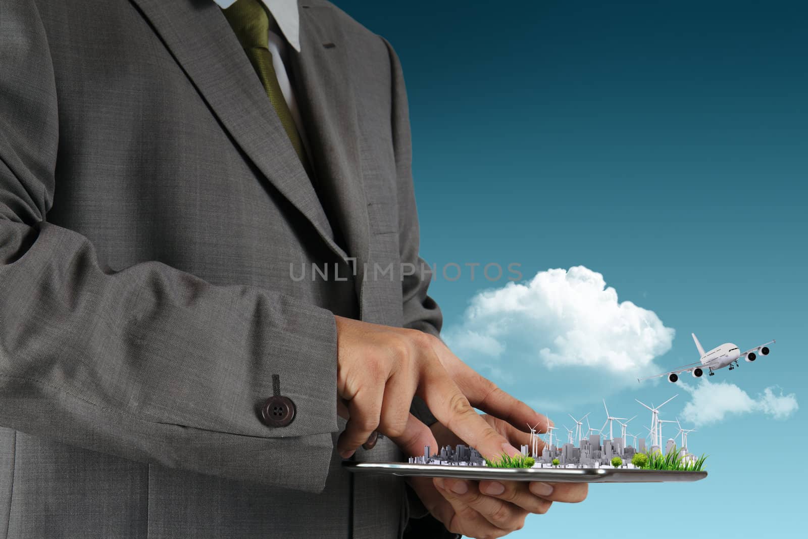 businessman hand holds touch pad as concept