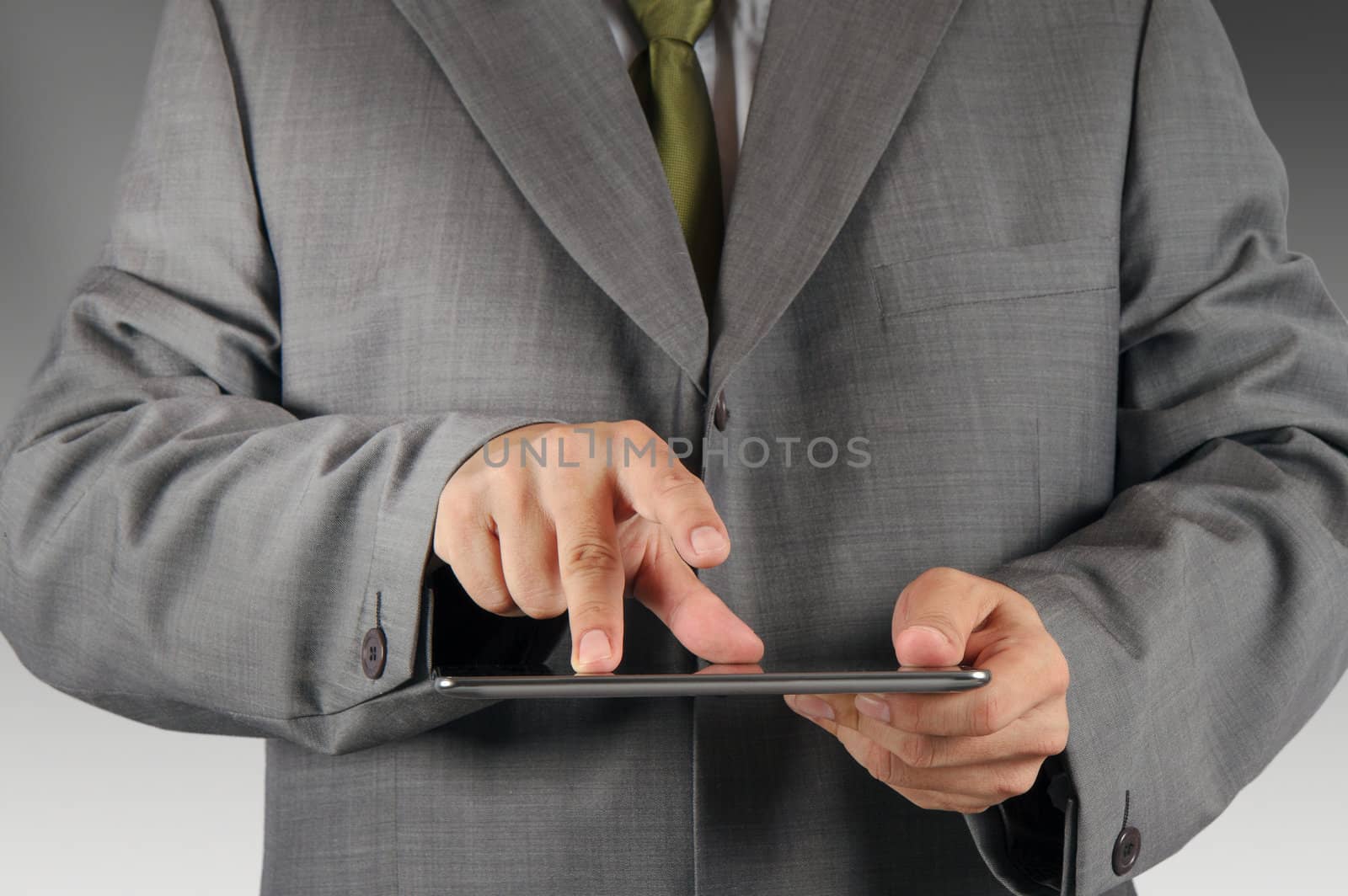 business man hand working on a digital tablet by buchachon