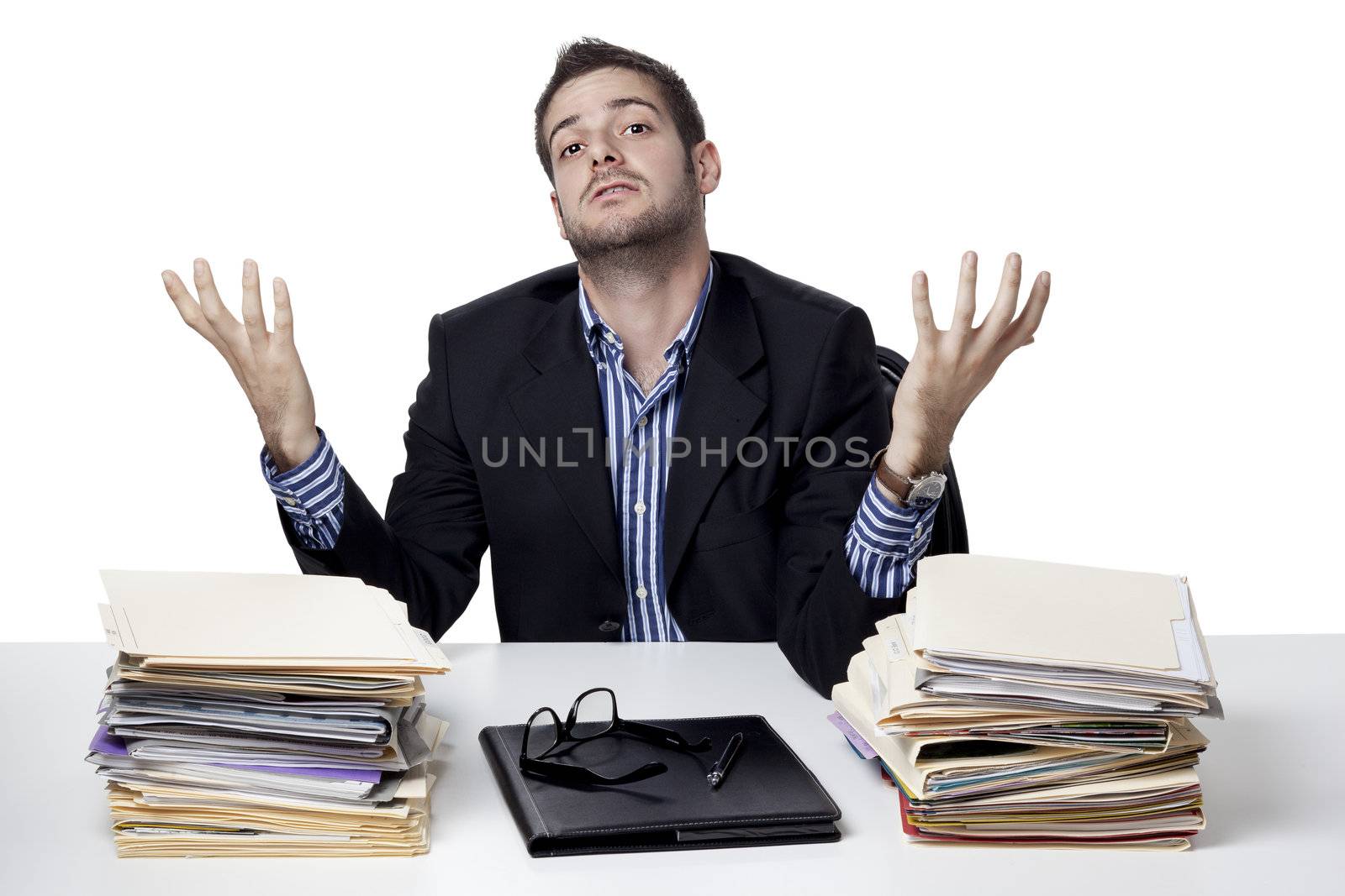 Businessman questioning while at work against white background, Model: Adam Mirani