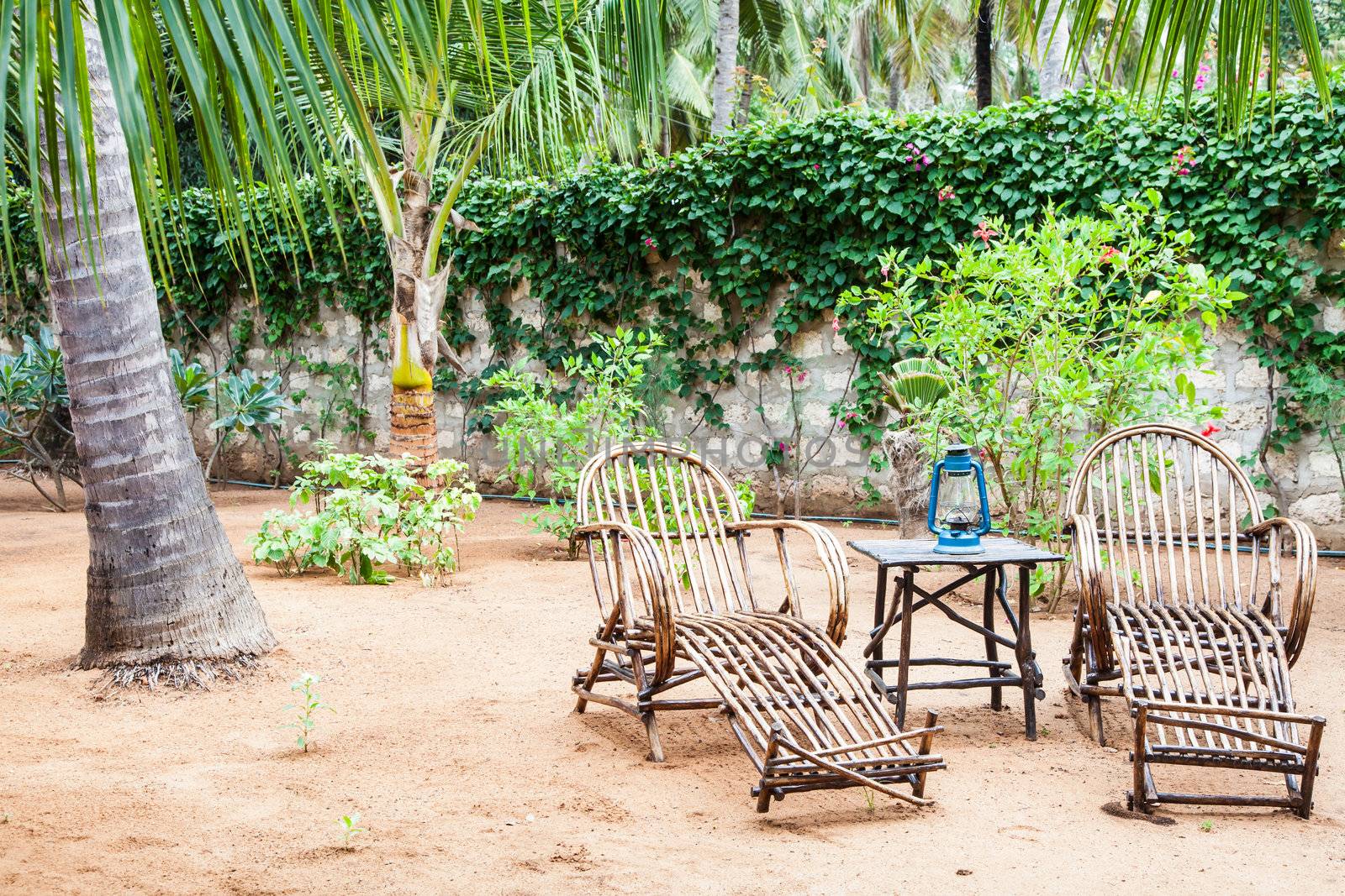 Kenya. Elegant furniture made of wood in an African garden