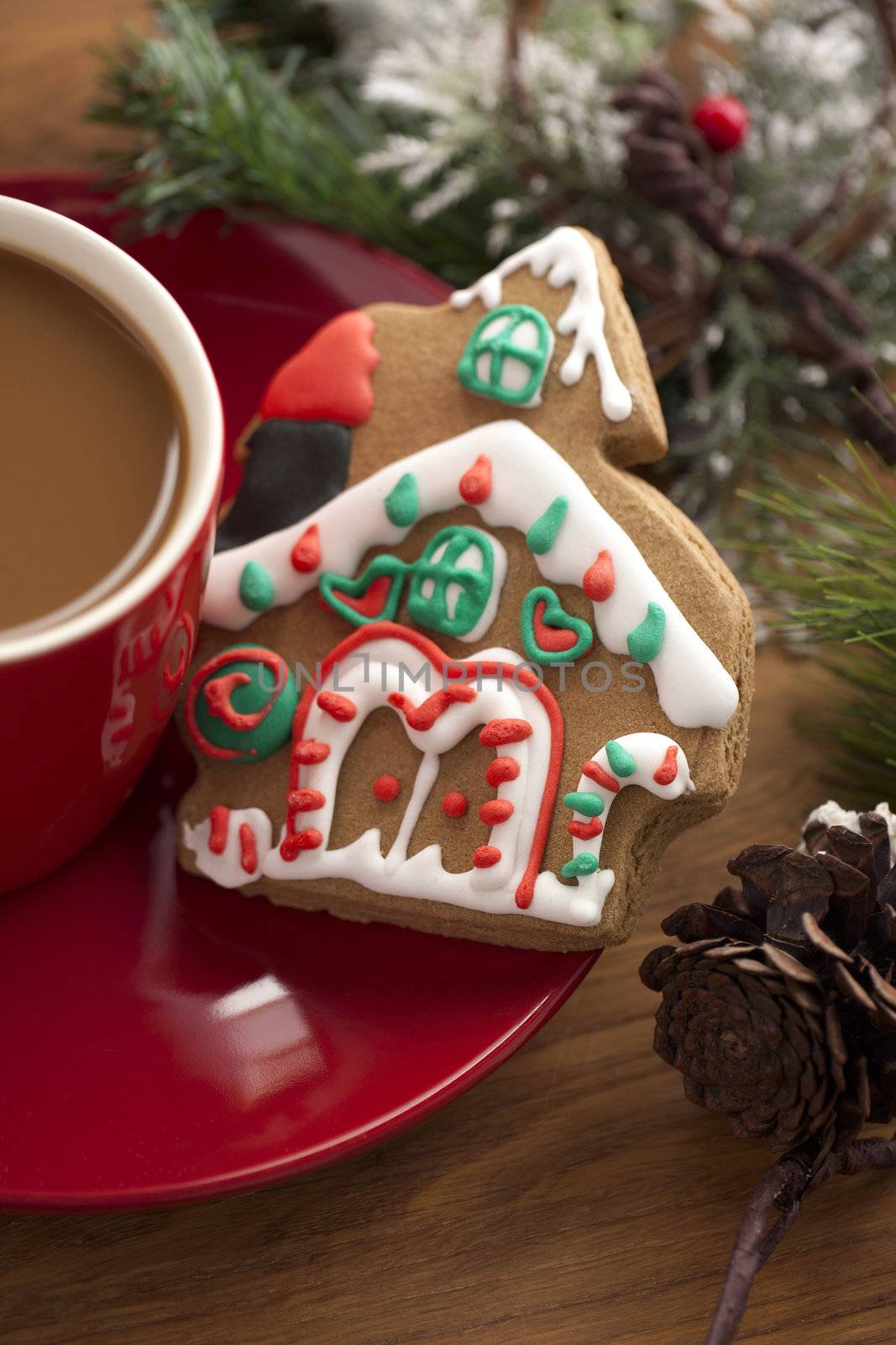 Cropped image of coffee cup with gingerbread house.