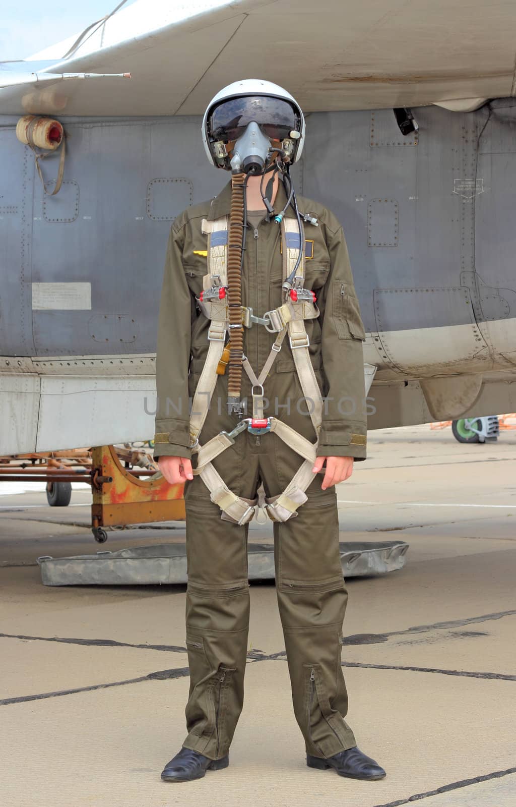 military pilot in a helmet near the aircraft