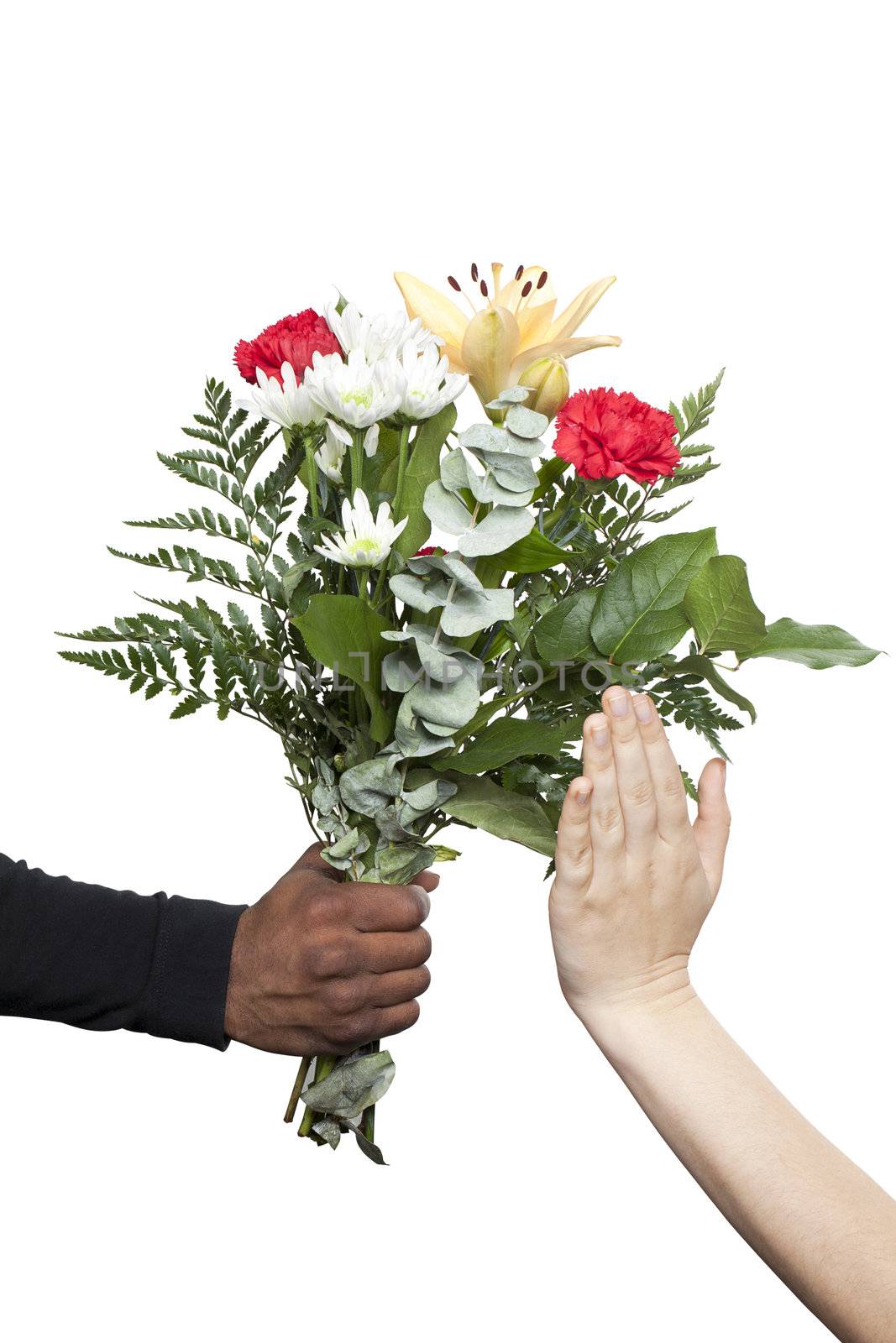 Female hand refusing the flowers that a black hand is giving