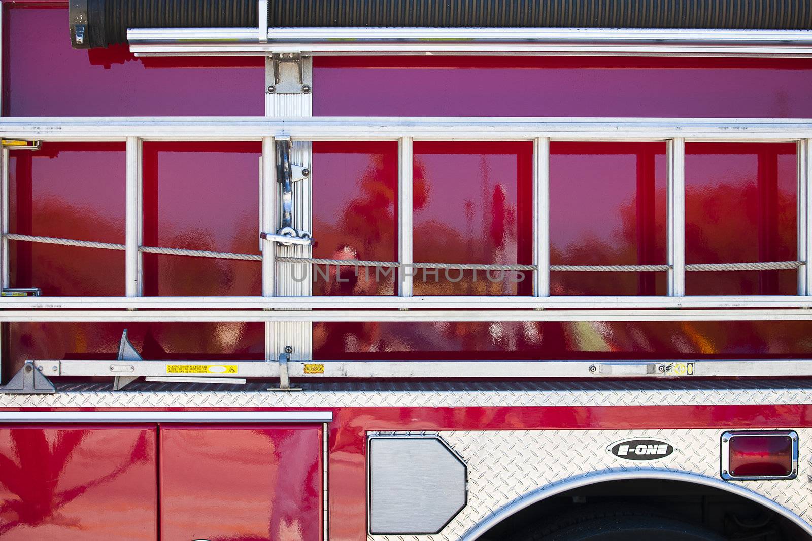 Side view of fire truck with ladder