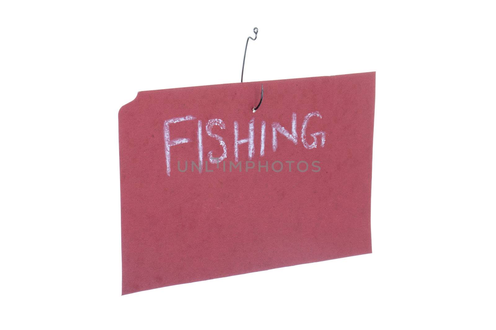 Close up image of fishing hook with pink paper with the word "fishing" on it against white background