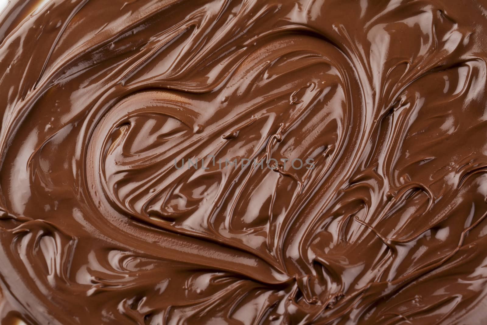 heart shape made up of melted chocolate by kozzi