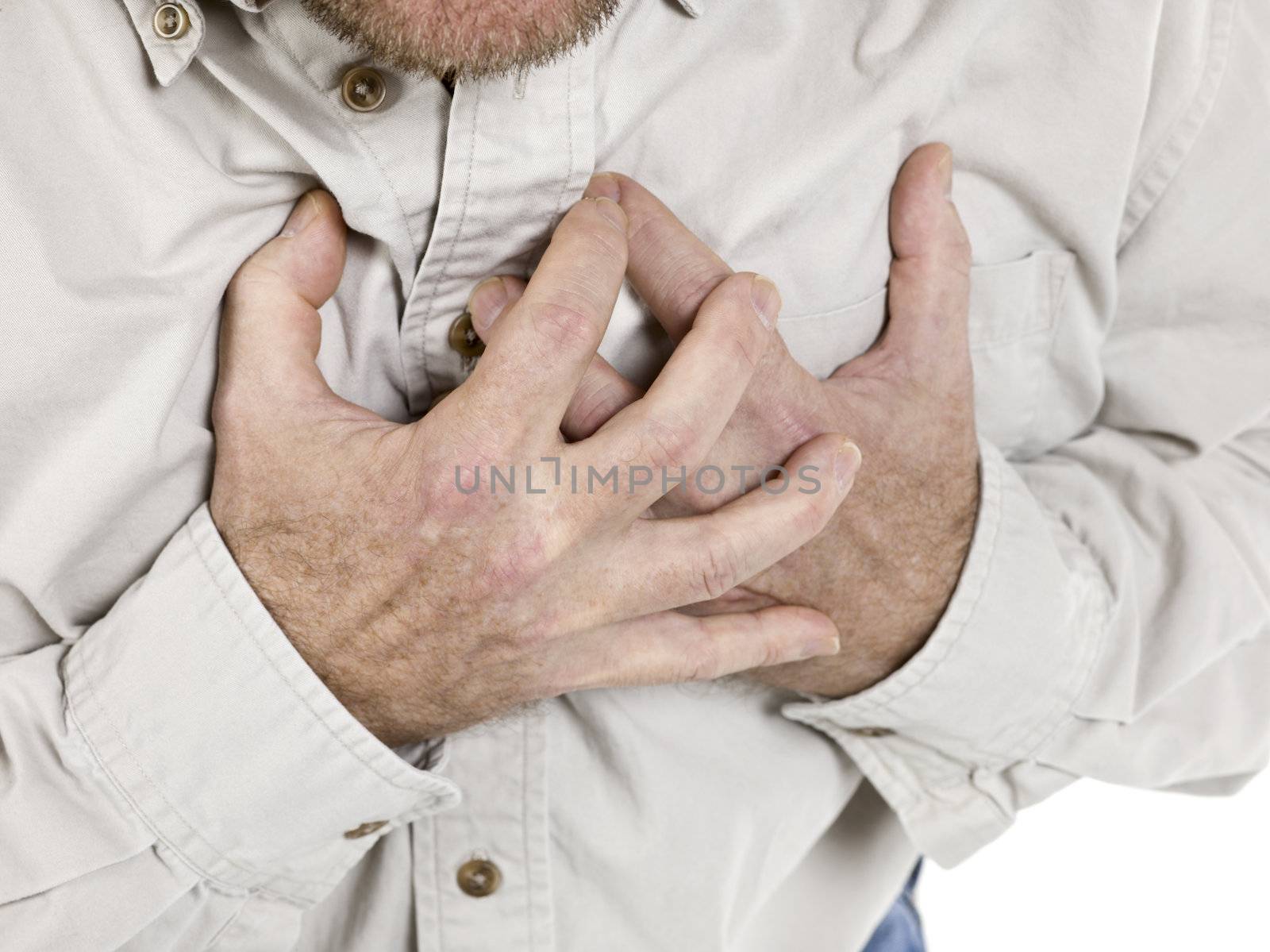 Image of an old man holding his chest suffering from the heart attack 