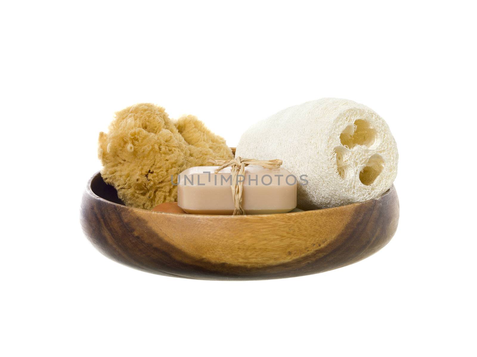  Spa products on a wooden dish against white background