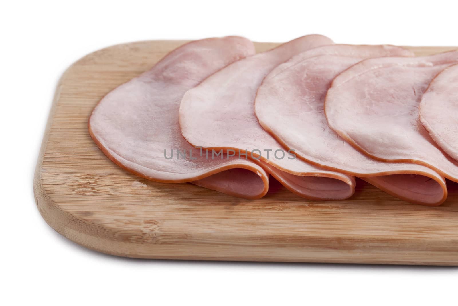 Spiral Sliced Ham on a wooden chopping board